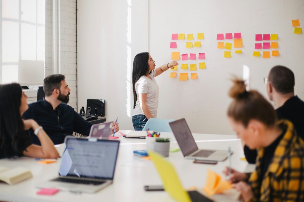 Professional lady giving a presentation to colleagues